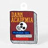 A die-cut sticker shaped like a stack of books, showing a maroon book cover with the text "DARK ACADEMIA," "MURDER 101," and "Scary Magic," plus a skull illustration.