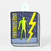 A die-cut sticker shaped like a book cover, printed with the word "FRANKENSTEIN" in yellow, a green human figure, and a yellow lightning bolt on a dark background.