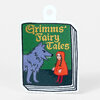 A sticker shaped like a small book cover with a hanging tab, printed with the text "Grimms' Fairy Tales" and an illustration of a wolf facing a girl in a red hood.