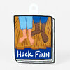 A die-cut sticker shaped like a book cover with an illustrated scene of two pairs of bare feet and the handwritten text "Huck Finn".
