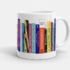 A white ceramic mug printed with a row of colorful book spines, including visible titles such as "DOMINGANA," "THE POET X," and "QUIET TAKES A BREATH."