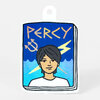 A die-cut sticker shaped like a hanging tag shows a cartoon portrait of a person with the word "PERCY" across the top.