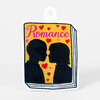 A die-cut sticker shaped like a book with the word "Romance" in pink script above two black silhouetted faces leaning in to kiss, surrounded by small red and pink hearts.