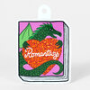 A sticker shaped like a book cover showing a green dragon hugging an orange glitter heart with the word "Romantasy" in white script.