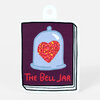 A sticker shaped like a book cover shows a pale blue bell jar with a glittery red heart on a dark purple background and the text “The Bell Jar.”