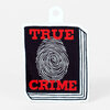 A sticker with the words "TRUE CRIME" in red over a black rectangle, a large white fingerprint in the center, and a white die-cut tab at the top.