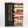 A black hardcover book titled "BIBLIOPHILE DIVERSE SPINES" with gold lettering, a yellow ribbon bookmark, and a front cover design of stacked colorful book spines showing various readable titles.
