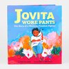 A hardcover book titled "Jovita Wore Pants: The Story of a Mexican Freedom Fighter" with a colorful illustrated cover showing a child in blue pants and white shirt among chickens and bright flowers.
