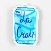 A die-cut sticker shaped like a blue can labeled "MALE TEARS" with large handwritten-style text reading "La Croix" and a small ©Kate Bingaman-Burt mark at the bottom.