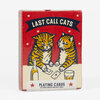 A red box of playing cards labeled "LAST CALL CATS" with two illustrated tabby cats, stars, and the text "PLAYING CARDS BY ARNA MILLER AND RAVI ZUPA."