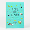 A turquoise book cover titled "A CAT'S GUIDE TO MONEY" with small illustrated cats, dollar bills, pencils, a calculator, and the author name "BY LILLIAN KARABAIC".