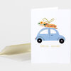 A folded white greeting card shows a blue car carrying flowers and a wrapped sandwich on top, with the words "SPECIAL DELIVERY" printed below.