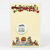 A small cream-colored notepad with a branch of red apples and green leaves across the top, an illustrated label reading "LITTLE TRUTHS STUDIO 50 PAGE NOTEPAD," and mice picnic artwork with apples at the bottom.