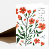 A folded greeting card with an orange-red floral illustration, a small dragonfly, and the handwritten text "I know this day is hard. I'm thinking of you."