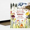 A greeting card with watercolor-style woodland illustrations and the printed message "PRECIOUS BABY THERE IS SO MUCH MAGIC FOR YOU IN THIS WORLD" on the front.