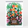 A spiral-bound wall calendar with a garden illustration of flowers, pea pods, strawberries, a black-and-white cat, a frog, and the text "2027 GARDEN DREAMS WALL CALENDAR".