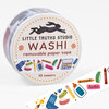 A roll of washi tape labeled "LITTLE TRUTHS STUDIO," "WASHI," "removable paper tape," and "10 meters," printed with colorful art-supply illustrations.