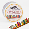A roll of washi tape labeled "LITTLE TRUTHS STUDIO" and "WASHI" with the words "removable paper tape" and "10 meters," decorated with illustrated books, cats, and small plants.