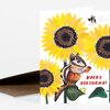 A folded greeting card featuring a chipmunk among large sunflowers with the text "HAPPY BIRTHDAY!" on the front.