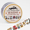 A roll of washi tape labeled "LITTLE TRUTHS STUDIO WASHI removable paper tape 10 meters" with a cozy home illustration visible on the label and tape strip.