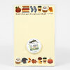 A rectangular notepad with a pale yellow cover, fall-themed watercolor illustrations along the top and bottom, a centered round label reading "LITTLE TRUTHS STUDIO 50 PAGE NOTEPAD," and the quote "Life starts all over again when it gets crisp in the fall. - F. Scott Fitzgerald."