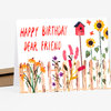 A folded greeting card with the hand-painted text "HAPPY BIRTHDAY DEAR FRIEND" and an illustration of a pink birdhouse above a fence with colorful flowers, sunflowers, and small butterflies.
