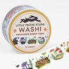 A roll of washi tape labeled "LITTLE TRUTHS STUDIO WASHI removable paper tape" and "10 meters," decorated with mushroom illustrations around the edge.