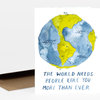 A folded greeting card with a watercolor illustration of the Earth and the text "THE WORLD NEEDS PEOPLE LIKE YOU MORE THAN EVER" on the front.
