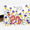A folded greeting card with a white front printed with purple and yellow pansies and a red spotted snake, and the text "There is no one like you" in cursive script.