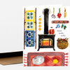 A folded greeting card shows a watercolor illustration of a cozy winter room with a wood stove, hanging mittens and dried flowers, a quilt ladder, a basket of firewood, a rug with a sleeping cat, and the text “warm winter wishes.”