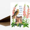 A folded greeting card with a watercolor illustration of a bird perched on a tree stump among pink flowers and green foliage, with the text "YOU'RE ALWAYS THERE FOR ME. THANK YOU." on the front.