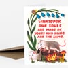 A folded greeting card with a botanical illustration of blue flowers, a snail, two opossums, mushrooms, and the printed quote "WHATEVER OUR SOULS ARE MADE OF, YOURS AND MINE ARE THE SAME. ~EMILY BRONTE (MOSTLY)".