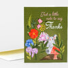 A folded greeting card with a green front printed with the text “Just a little note to say Thanks” and a floral illustration featuring a small gray mouse, flowers, and leaves.