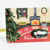 A greeting card showing a cozy holiday room with a decorated Christmas tree, a wood stove, a wreath, and a white cat lying on a rug, with the text “Warm Wishes.”