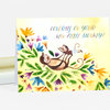 A folded illustrated notecard with two monkeys among colorful leaves and flowers, and the text "CONGRATS ON YOUR NEW LITTLE MONKEY!" on the front.