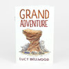 A white zine cover titled "GRAND ADVENTURE" with an illustration of a large layered rock formation and small canoes at the base, and the name "LUCY BELLWOOD" at the bottom.