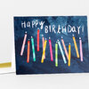 A birthday greeting card with the handwritten text "Happy Birthday!" above a row of colorful lit candles on a dark blue background.