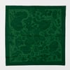 A green square bandana with a leafy swirl pattern and darker border.