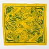 A square yellow bandana with a green border and a green tiger illustration surrounded by stylized plants and abstract shapes.
