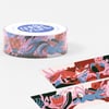 A roll of washi tape printed with colorful floral and fox illustrations, with a top label that reads "meg hunt" and "meghunt.com".