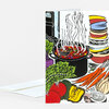A folded greeting card with a colorful illustrated soup pot and assorted vegetables, bowls, and steam rising from the center.