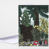 A folded greeting card with a forest scene showing tall evergreen trees, tree stumps, leafy plants, and red mushrooms on the front.