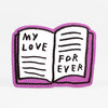 A sticker shaped like an open book with a purple outline and the hand-lettered text "MY LOVE FOR EVER" across the pages.