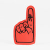 A red finger-shaped sticker with a black outlined hand making a middle-finger gesture and a small bow-like mark near the top.