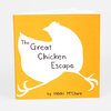 A small orange booklet with a white chicken silhouette on the cover and the title "The Great Chicken Escape" with "by Nikki McClure" printed below.