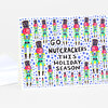 A folded greeting card with a repeating pattern of colorful nutcracker figures and the text "GO NUTCRACKERS THIS HOLIDAY SEASON."