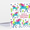 A birthday greeting card featuring colorful unicorns, blue stars, green trees, and the text "HAVE A LEGENDARY BIRTHDAY" on the front.