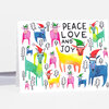 A folded greeting card printed with colorful stylized cows wearing Santa hats, small pine trees, and the text "PEACE LOVE AND JOY".