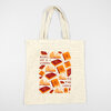 A natural canvas tote bag with two handles and a front graphic of books and open books around the text "BOOKS ARE A WINDOW TO THE WORLD."