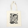 An off-white canvas tote bag with two handles and a black illustrated Oregon design featuring the word "OREGON" in large letters.
